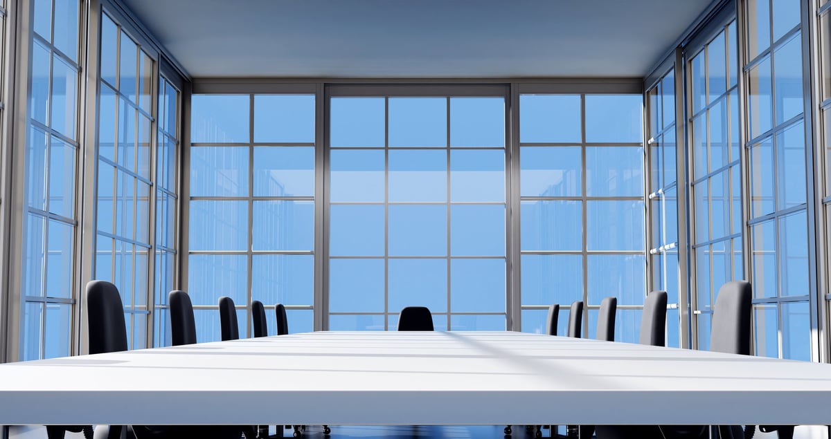 Conference table and chairs in empty meeting room