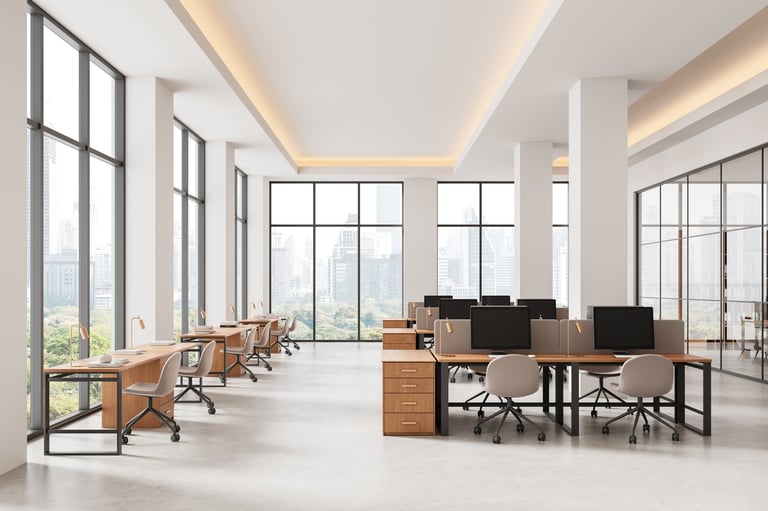 Spacious modern office interior with large windows and natural light